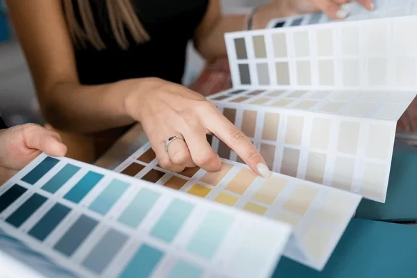 closeup-two-women-choosing-samples-600nw-1854889246